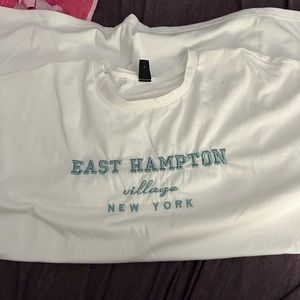 white short sleeve t shirt reads “east hampton”